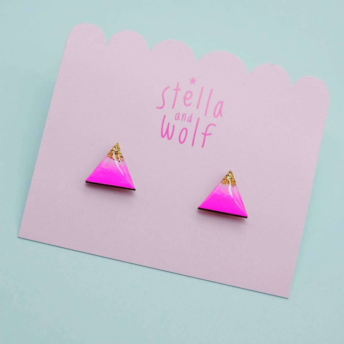 Neon pink and gold glitter triangle studs